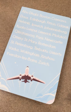 A customized travel journals featuring a plane printed by Alexander's Print Advantage