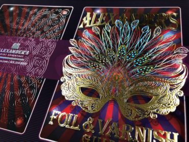 A photo of the Alexander's foil and varnish sample booklet that highlights all the capabilities Alexander's can provide for Halloween print creations