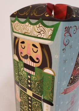 A nutcracker illustration on the the side of Alexanders' custom company Christmas gift box
