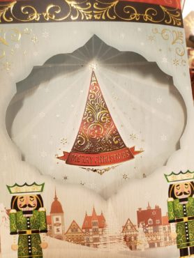 An illustration of nutcrackers and Christmas tree on the front of Alexanders' Christmas card that also accompanied Alexanders' custom company Christmas gift box